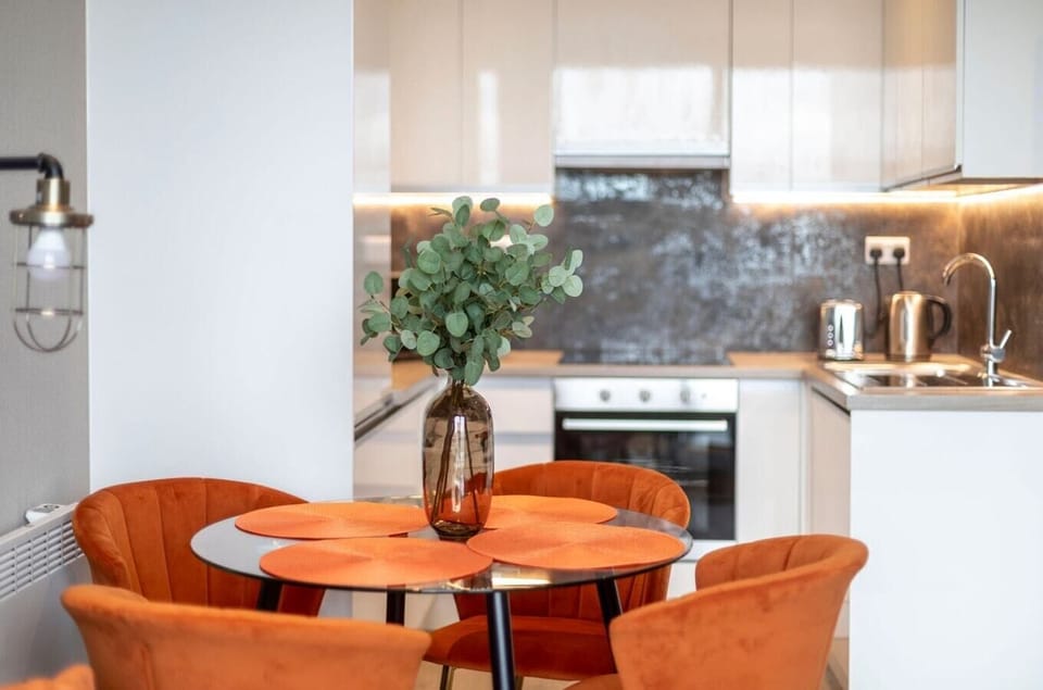 Integrated living and kitchen spaces in an open layout with direct access to a private terrace.