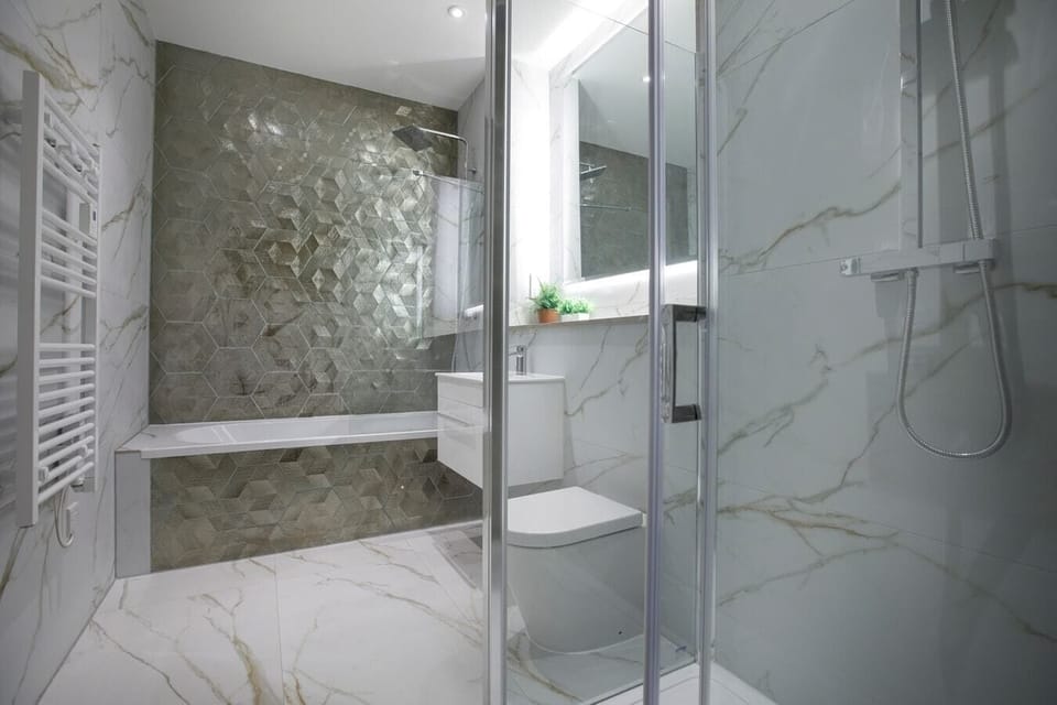 Bathroom with bathtub and separate shower