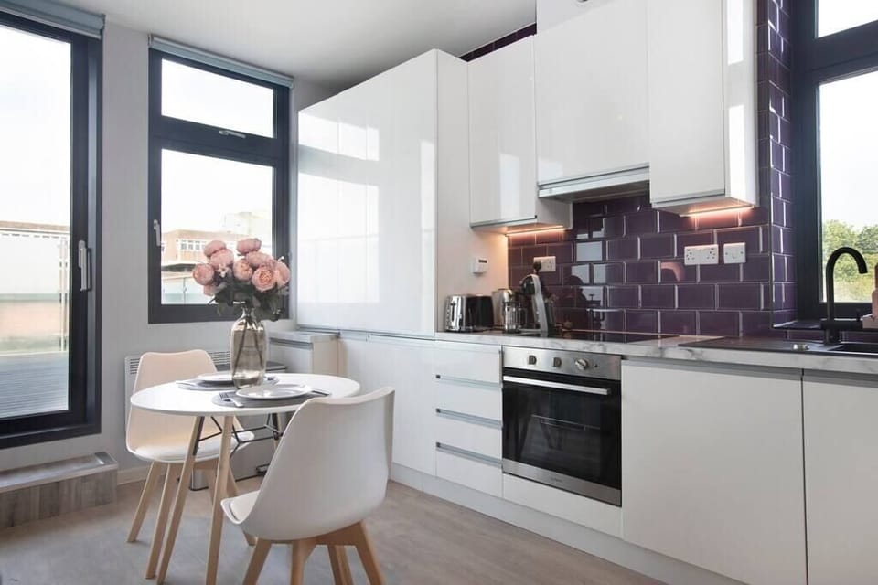 Integrated living, bedroom, and kitchen spaces in an open layout.