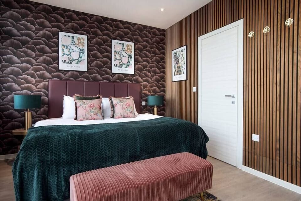 Integrated living, bedroom, and kitchen spaces in an open layout.
