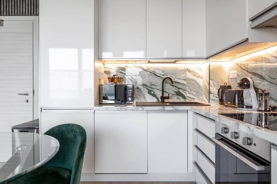 Integrated living, bedroom, and kitchen spaces in an open layout.