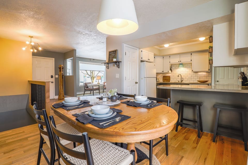 View from dining area of fully stocked kitchen and upstairs living area.