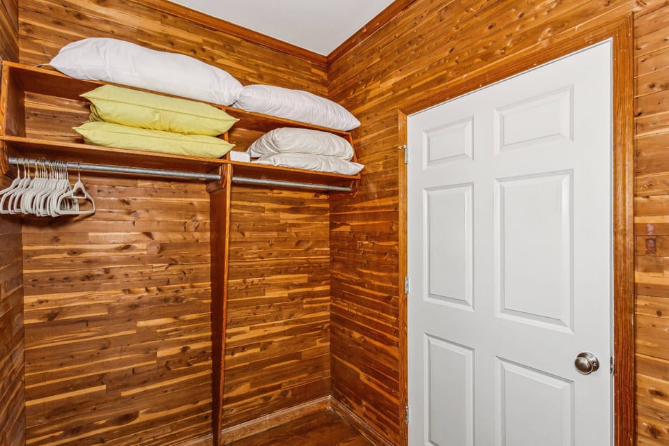 The primary bedroom has features a large walk-in cedar closet