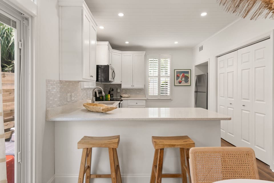 Enjoy your breakfast and coffee on the barstools at the kitchen island.
