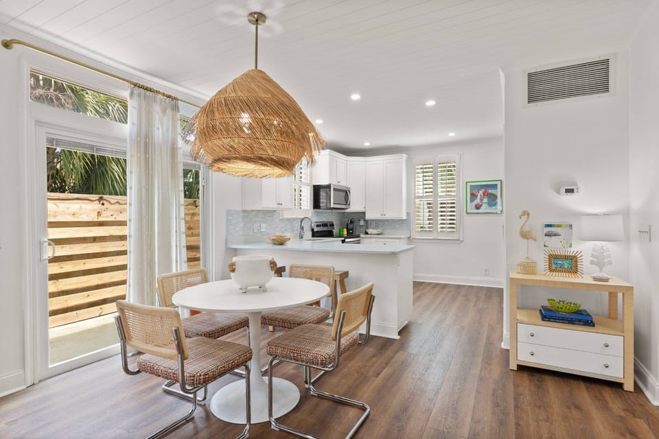 Kitchen and dining space leading out to the back patio area.