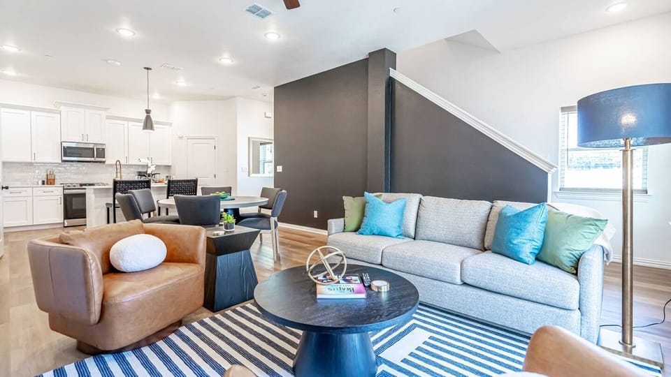 Kick back in a stylish, open-concept living space designed for comfort and connection. Whether you're debriefing after a Rangers game, watching pre-game coverage on the smart TV, or just relaxing with your crew—The Ryan's living area has you covered.