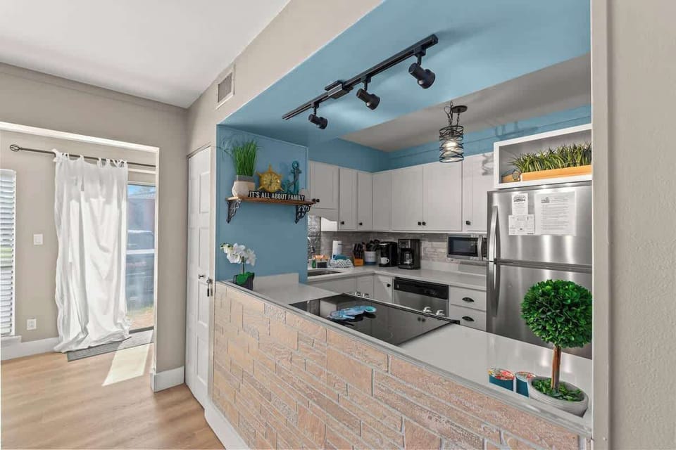 The kitchen area has an open concept to the living room for enjoying your meals and time together.