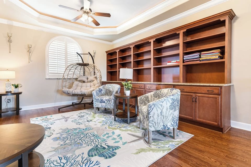 With this living room’s stylish decor and inviting atmosphere, settle in to watch your favorite movie or enjoy a good book on the swing chair.