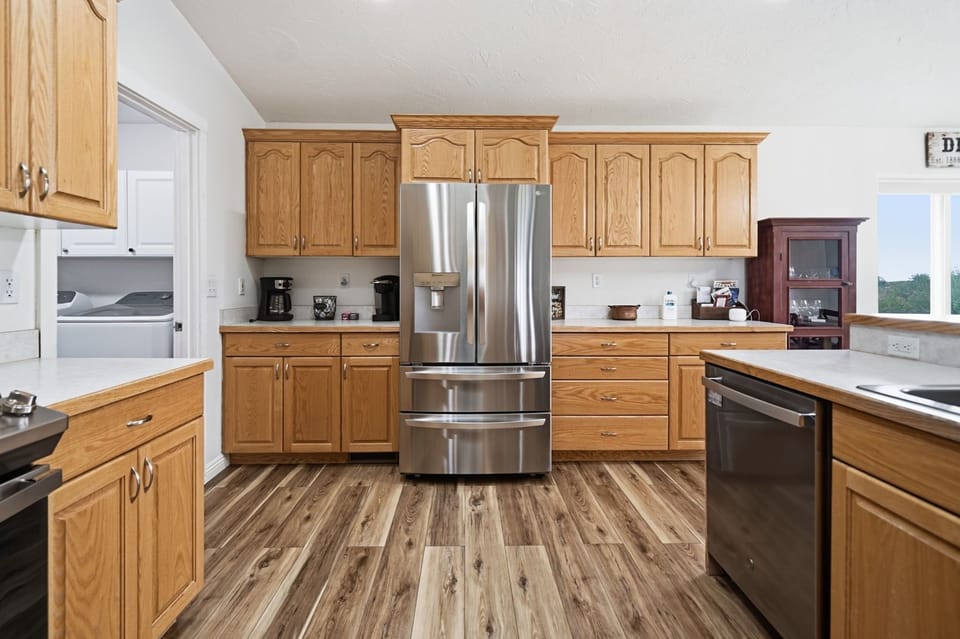 Spacious kitchen with stainless appliances and abundant cabinet space