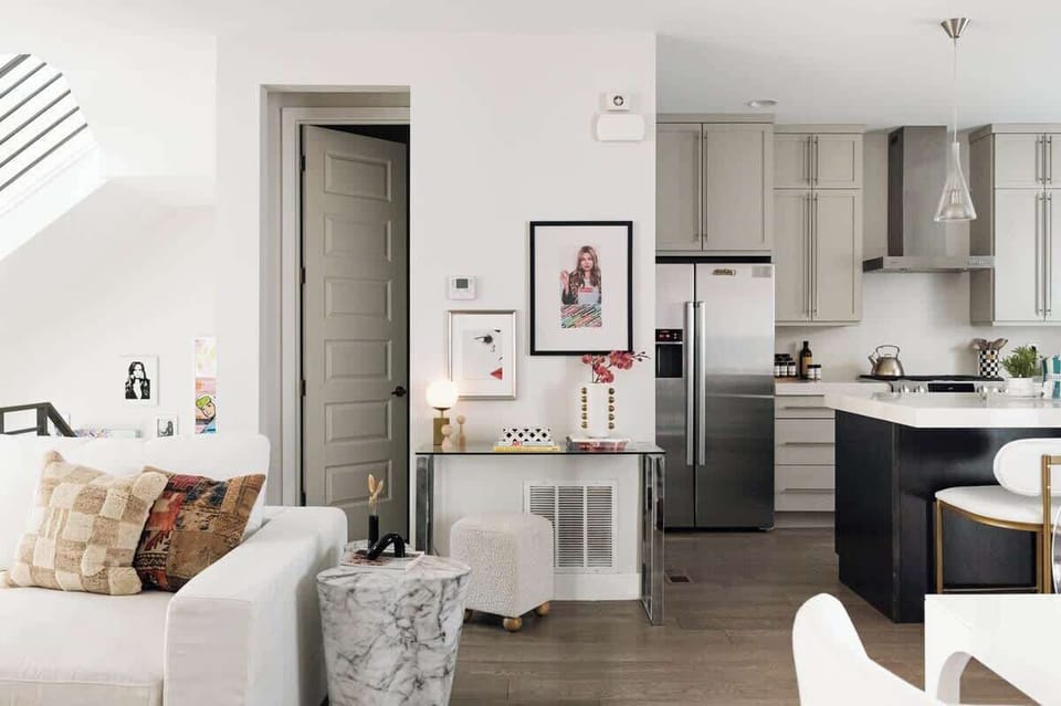 Living area, half bathroom, and kitchen