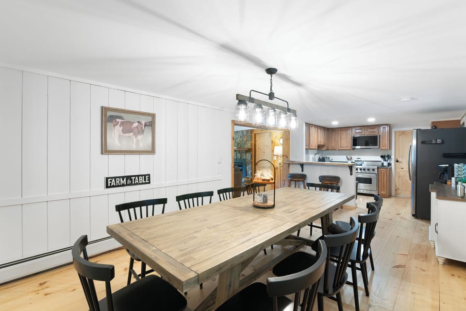 Seating for 10 at the dining table with more seating around the kitchen island