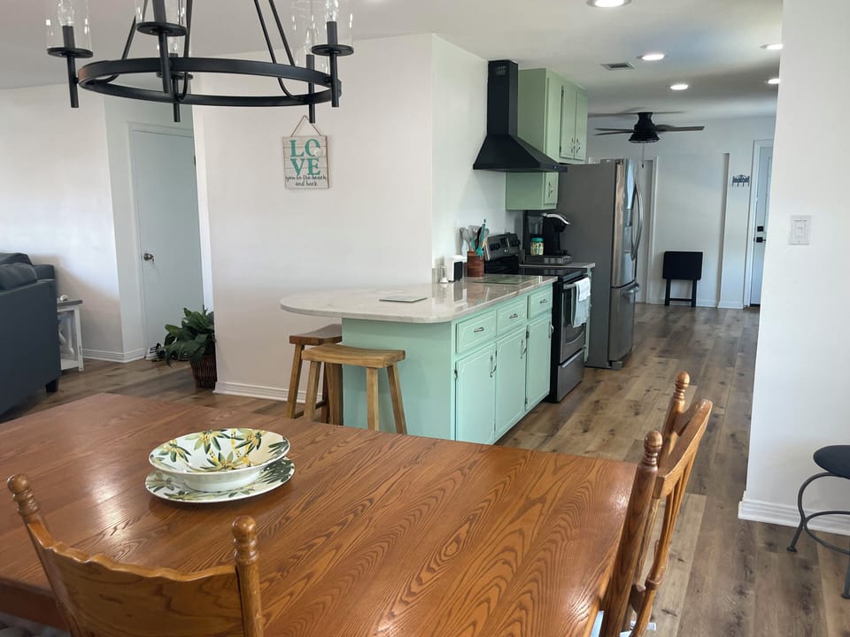 Open floor plan from kitchen to dining room to living room