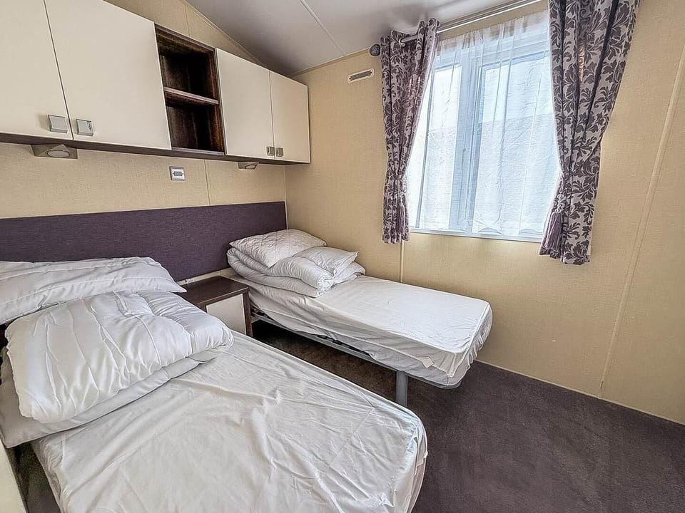 Experience the best of caravan holidays in Suffolk with welcoming caravans featuring multiple bedrooms, perfect for a comfortable UK staycation.