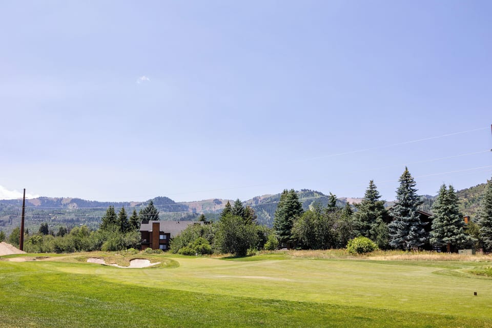 - Golf course views with rolling greens  
- Scenic backdrop of pine trees and hills  
- Perfect for morning walks and play