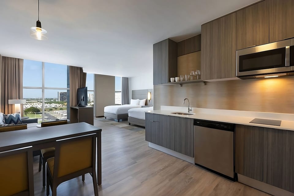 Cook easy meals while sunlight pours through corner windows.