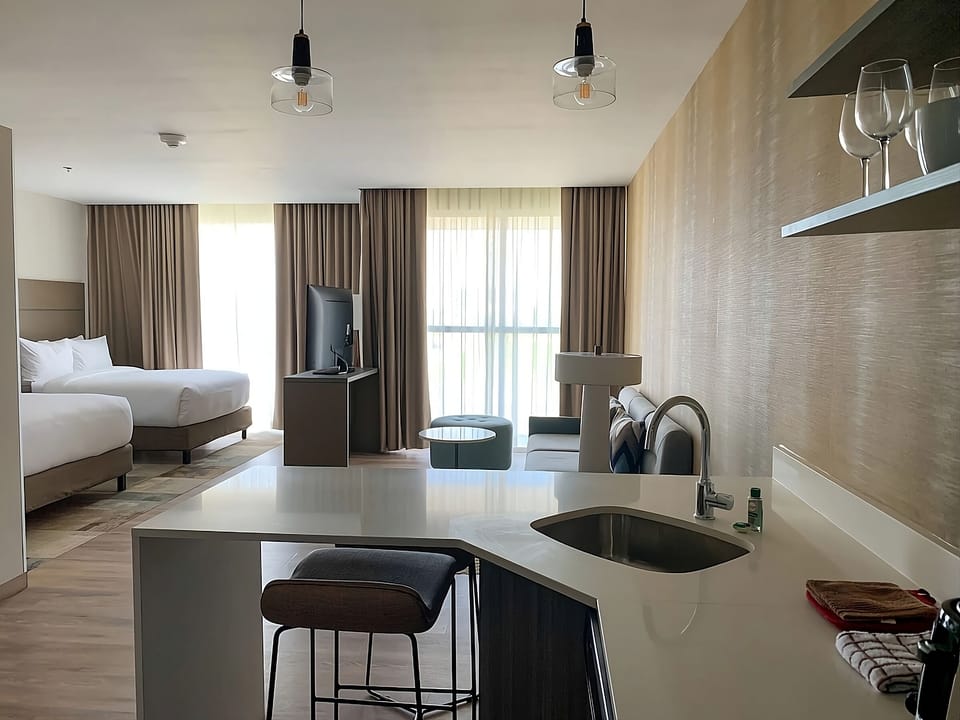 Sip morning coffee at the sleek island breakfast bar.