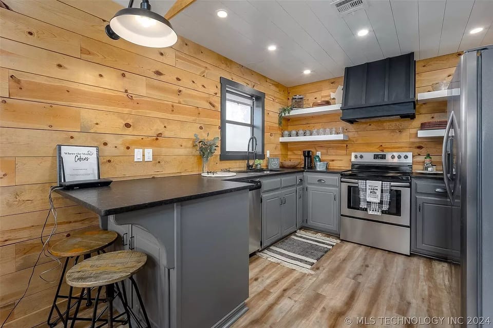The well-stocked kitchen has the utensils, pots, pans, and skillets you'll need.