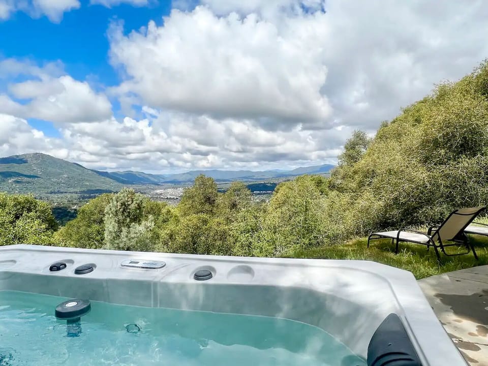 Soak in the preheated hot tub, gazing at the clouds float by.