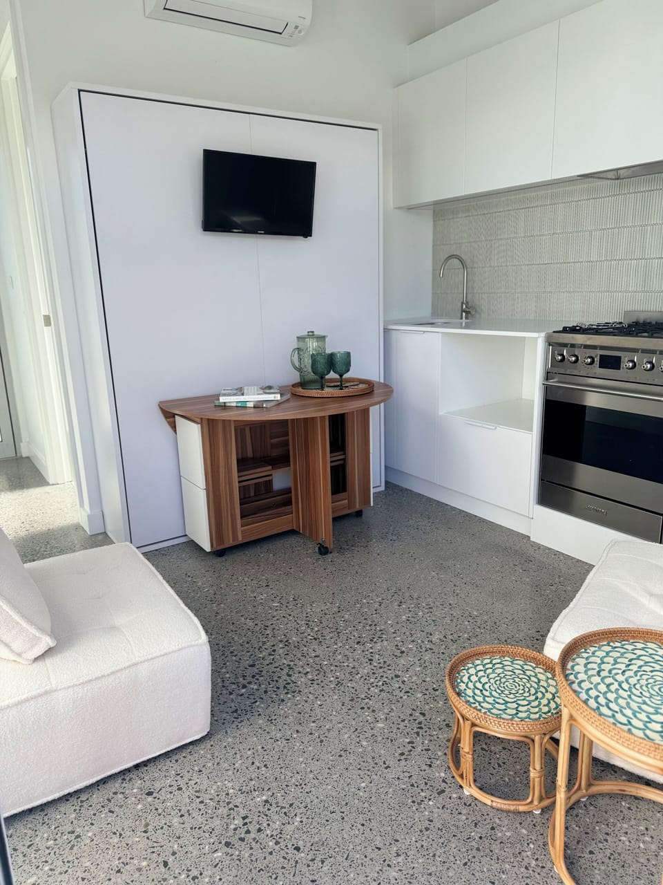 Living area which converts to a bedroom in this clever and stylish tiny space. 