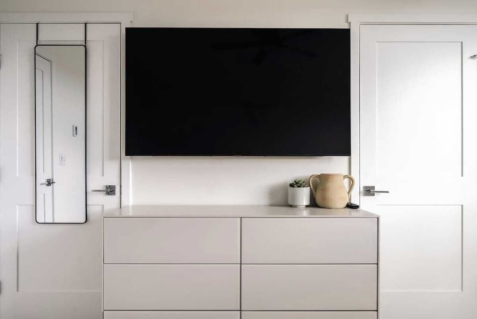 Primary bedroom with flatscreen TV