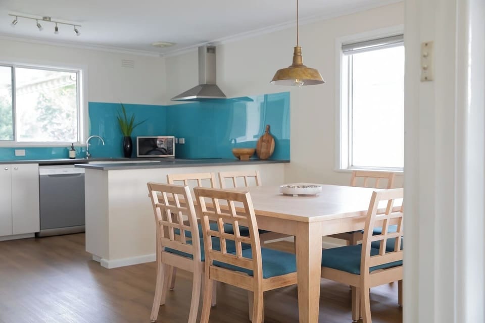 The open plan kitchen and dining area allows plenty of space for everyone to come together for a shared meal at home.
