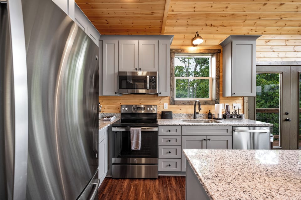 Full kitchen with stainless appliances 