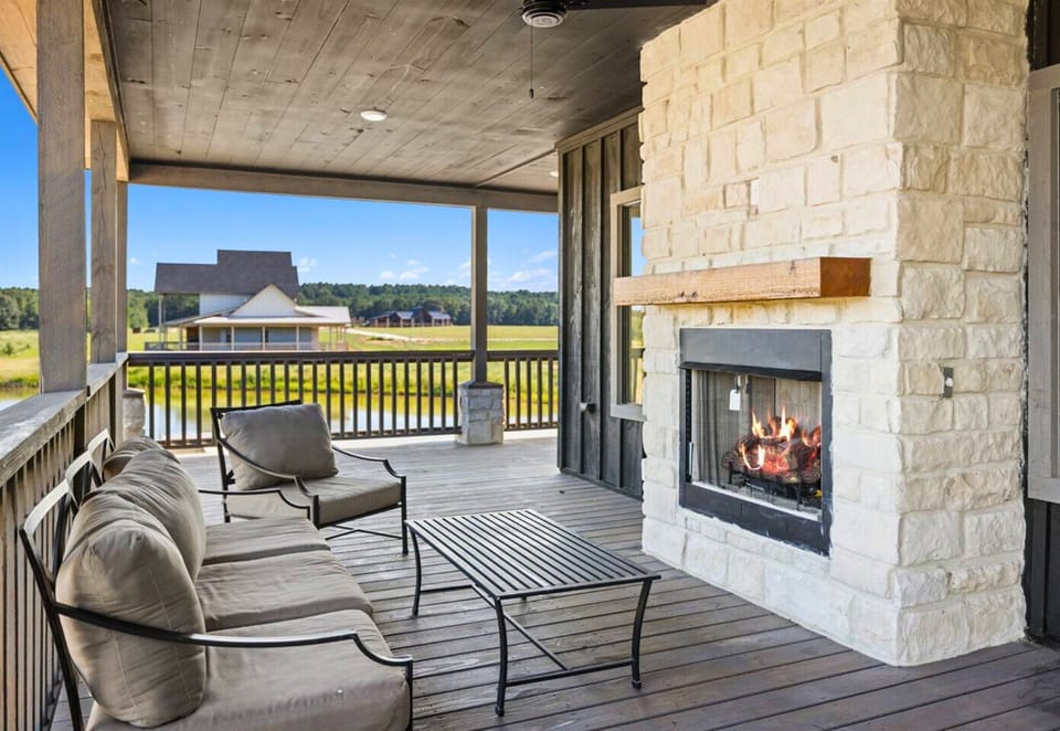 Here’s our comfy outdoor patio with a stone fireplace. It’s the ideal place to sip your morning coffee or unwind with a glass of wine while enjoying the scenic views.