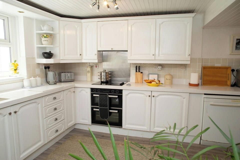 Kitchen with toaster, microwave and kettle