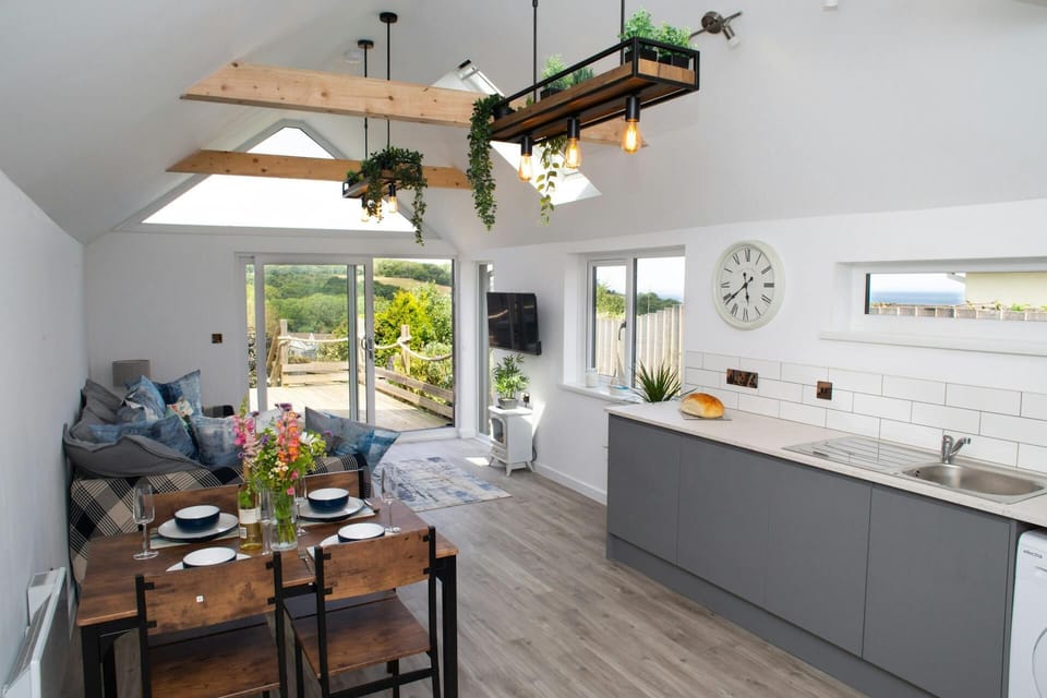 Open plan living area with patio doors leading to the deck