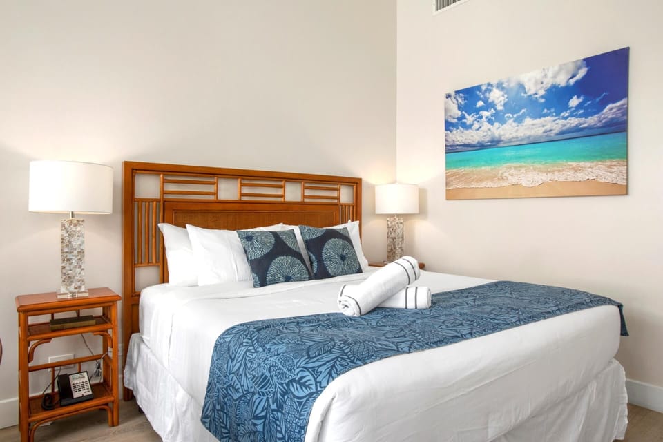 This vibrant suite blends comfort and charm with coastal art, warm wood tones, and ocean-kissed personality    