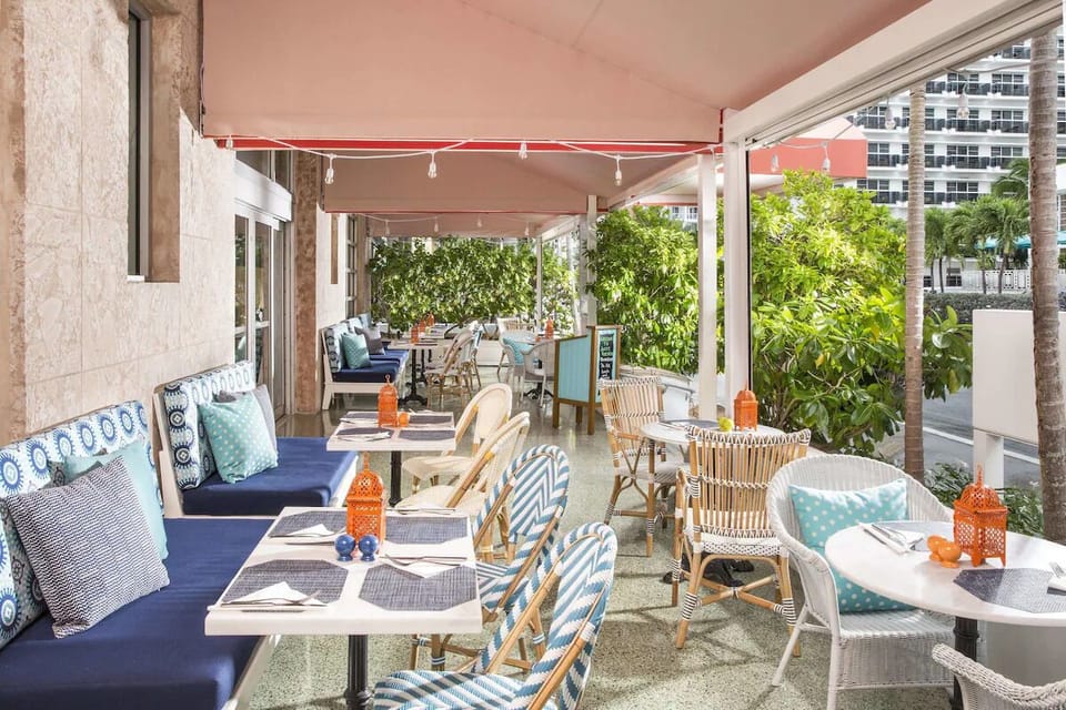 Savor morning coffee on the breezy, palm-lined terrace.