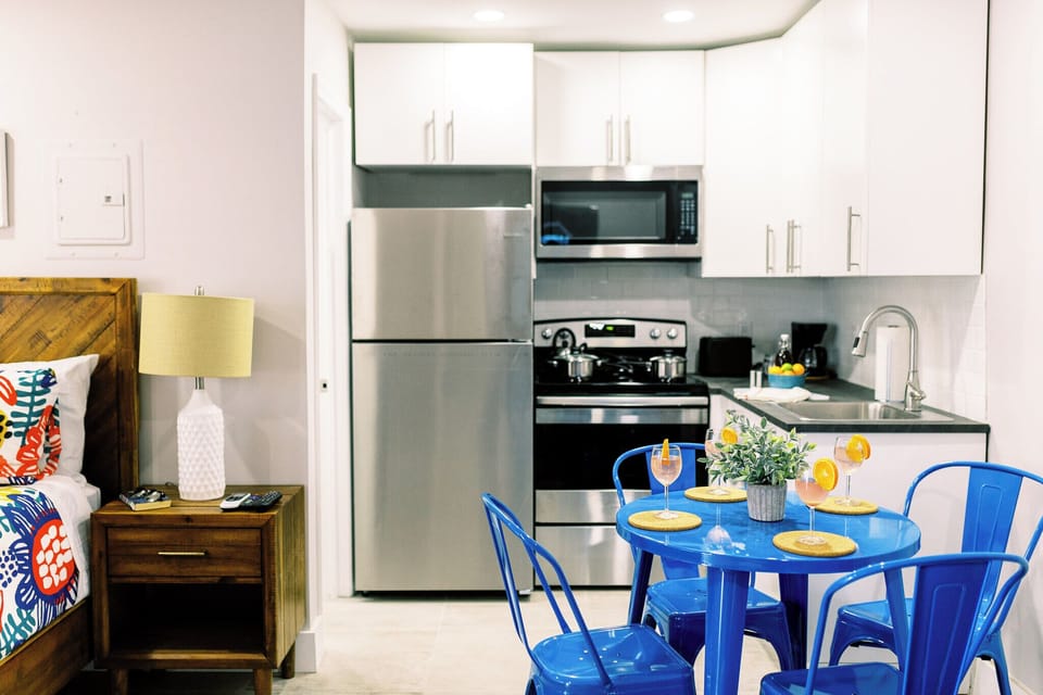 Experience culinary magic in our contemporary kitchen, seamlessly connected to the inviting dining area. A perfect setting for creating delightful meals and shared moments with loved ones. 