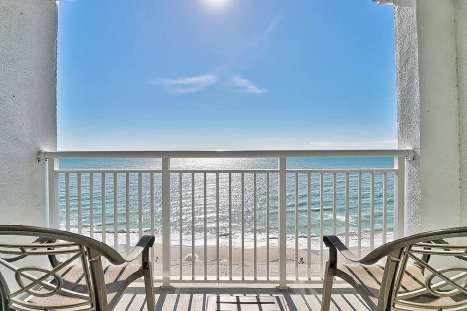 Indulge in the ultimate beachfront escape at Camelot Resort, where the 16th-floor condo offers unrivaled panoramic views of the ocean and skyline.