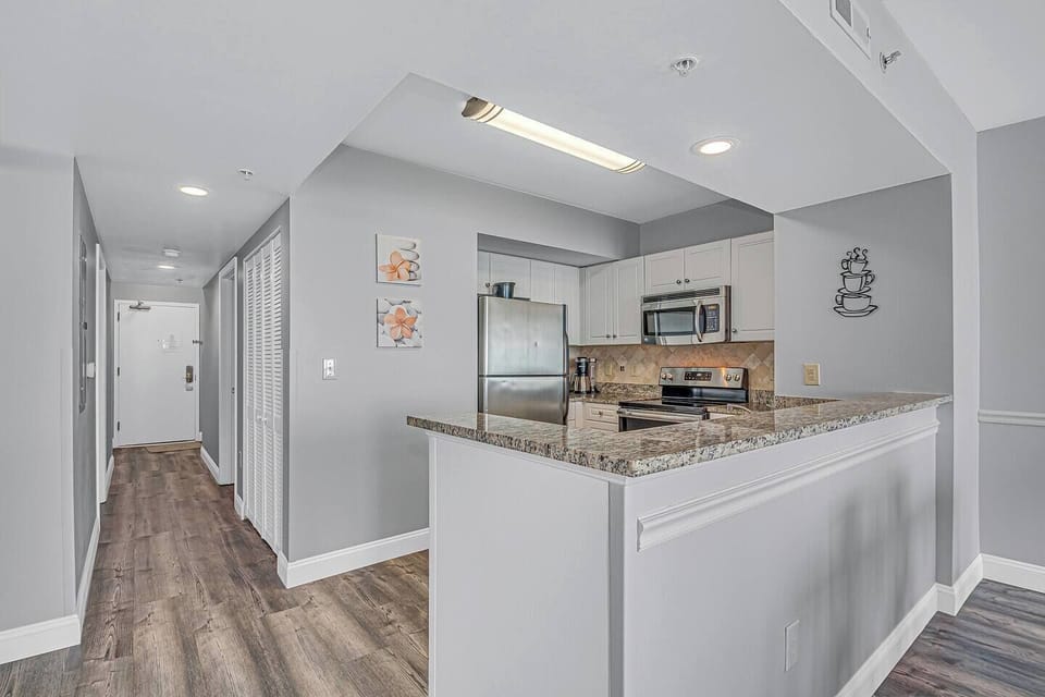 You'll find pleasure in preparing meals in this well-equipped kitchen.