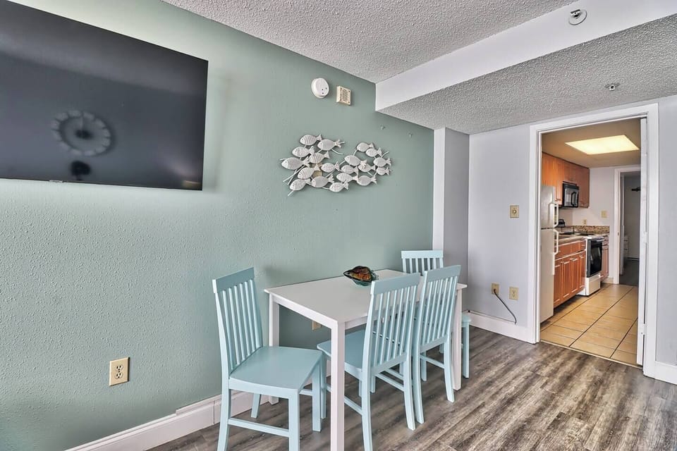 Highlight the well-appointed dining space, featuring elegant furnishings and thoughtful details that elevate the overall dining experience.