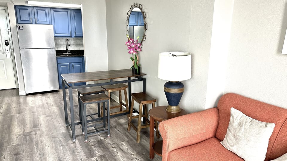 Experience the elegance of an open-concept kitchen in our suite, where stylish design seamlessly merges with functionality to create a sophisticated cooking space.