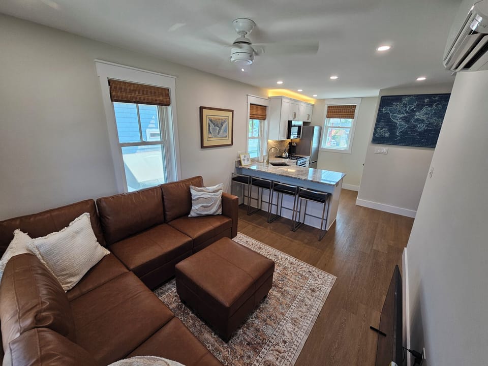 Living with a sectional couch that converts to a full-size bed.