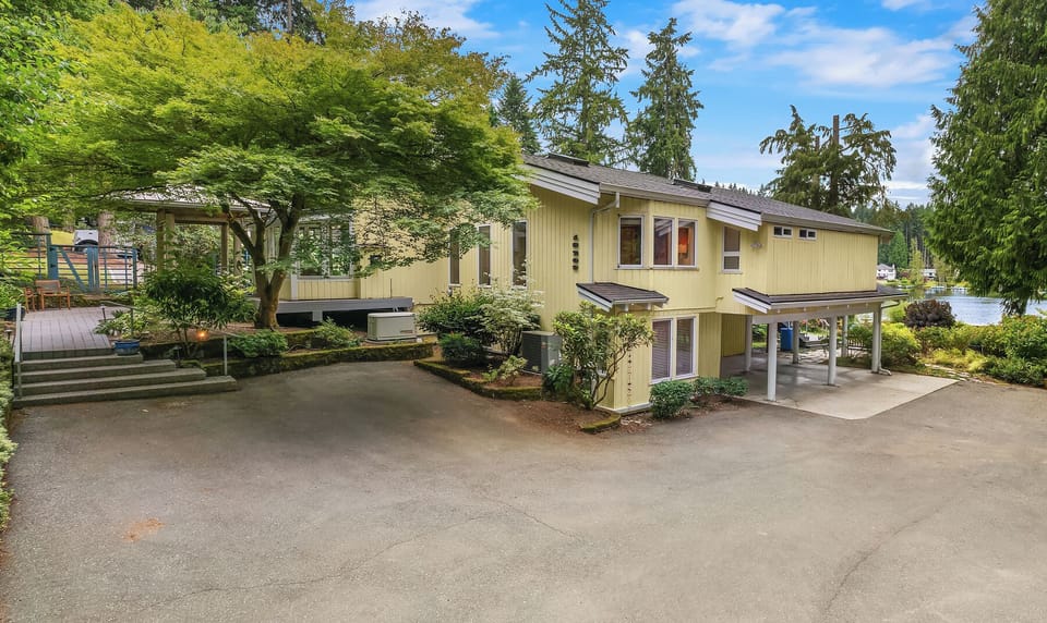 Southern view of parking, car ports, Maple Tree Bedroom, and Downstairs Study