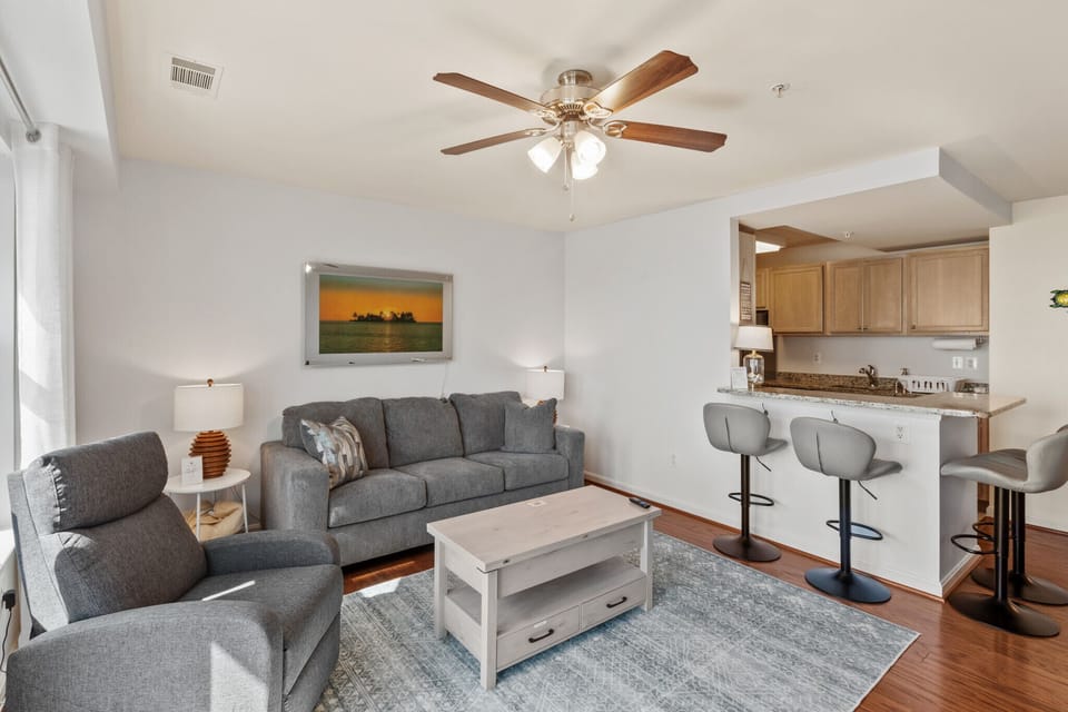 Open-concept living area with a queen sleeper sofa