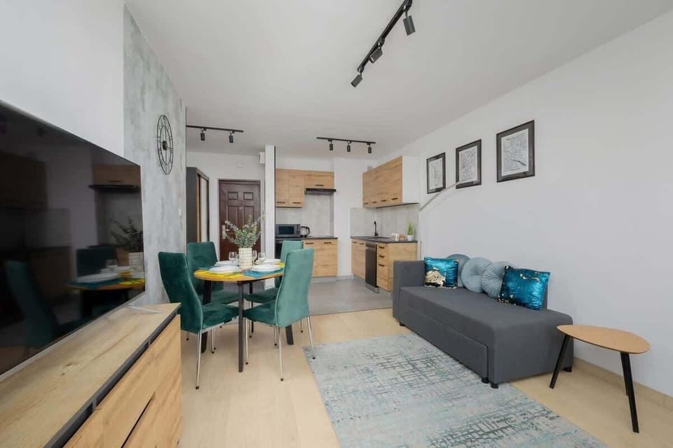 A tastefully designed open-plan dining and living space with vibrant seating. Great layout for shared meals and lounging.