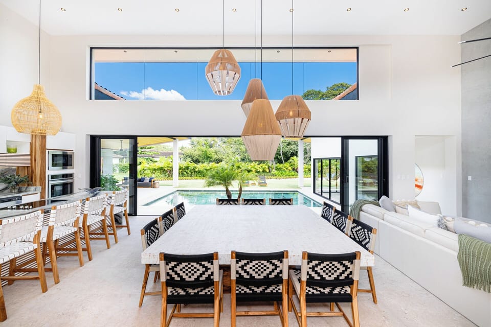 Central kitchen, dining, and living space