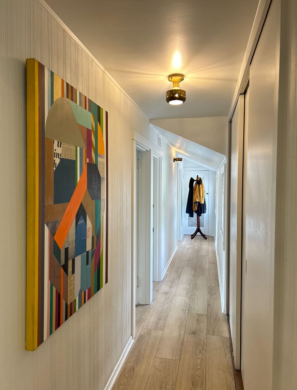 Hallway from living space includes two closets for added storage.
