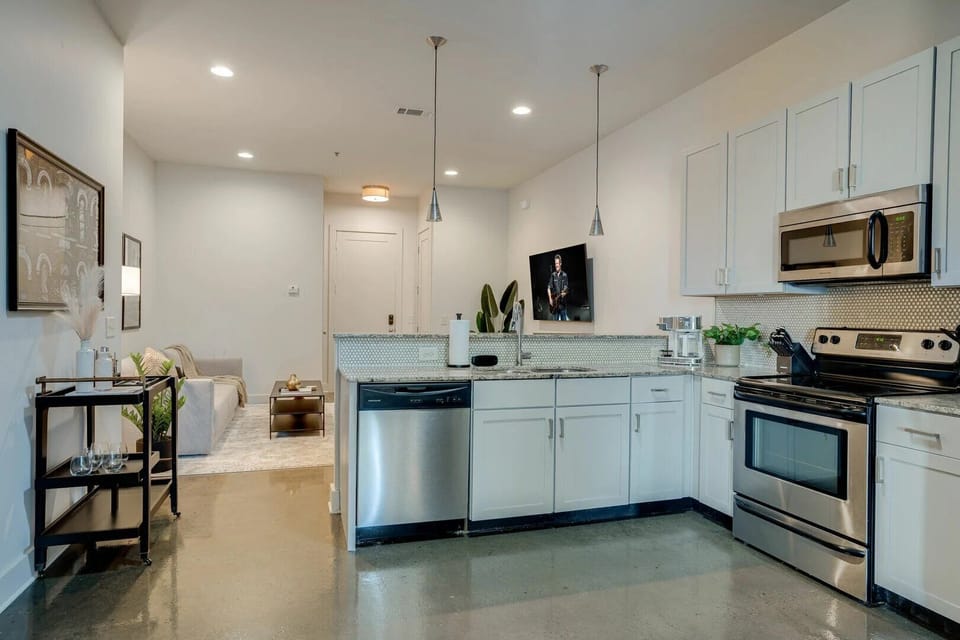 Unit 1: Fully equipped kitchen with stainless steel appliances, breakfast bar seating, and fully stocked with your basic cooking essentials.