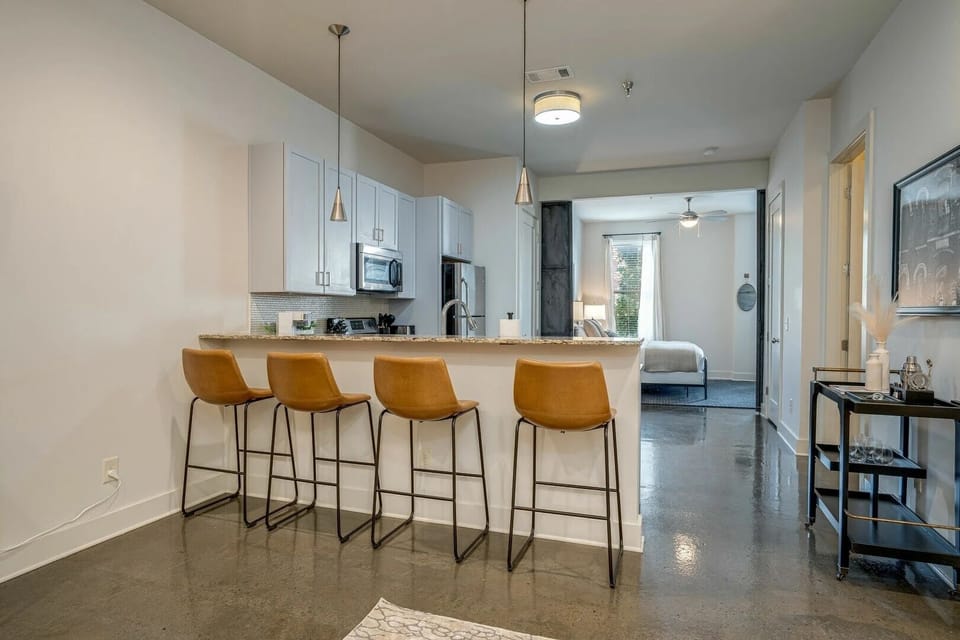 Unit 1: Fully equipped kitchen with stainless steel appliances, breakfast bar seating, and fully stocked with your basic cooking essentials.
