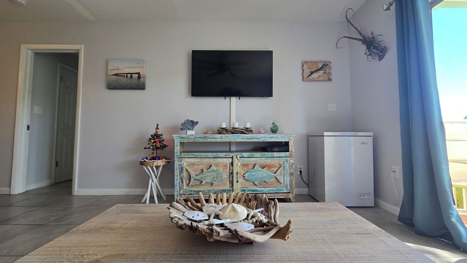 Smart TV & Complimentary Chest Freezer for Bait. 