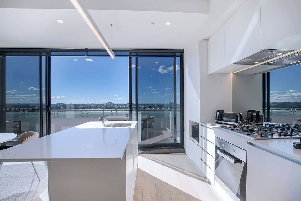 A modern kitchen offers all you need to prepare meals at home, plus a dishwasher for easy clean-up. 
