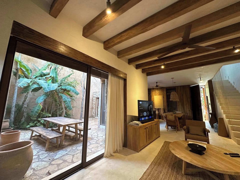 Access to a private patio from the living room of the property.