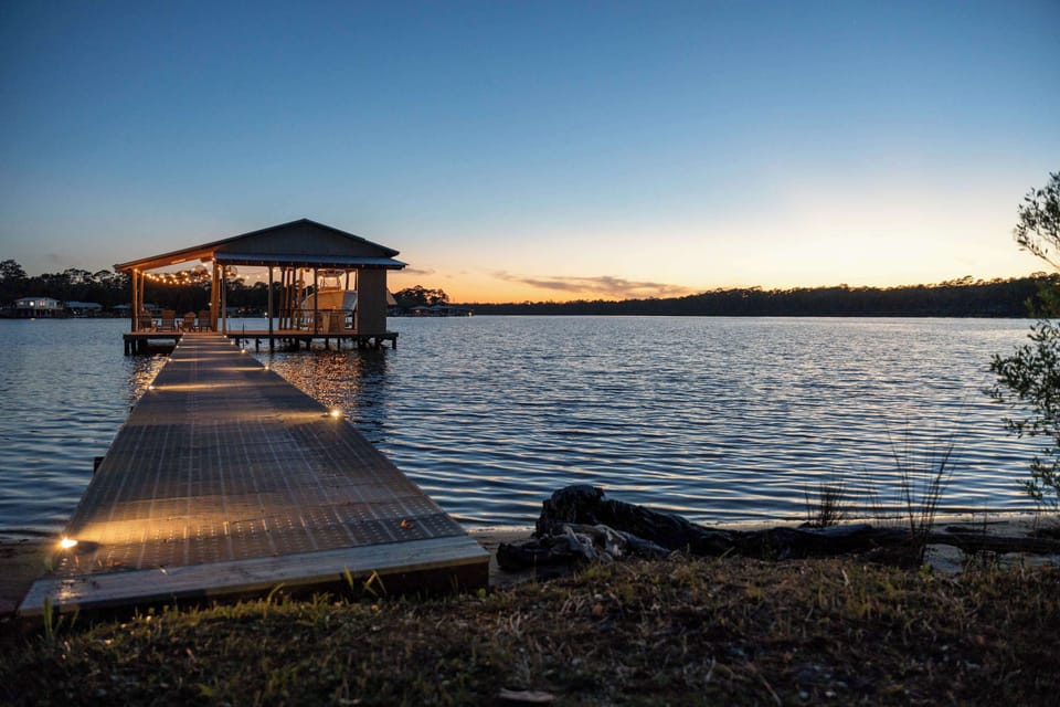 Set up a cozy evening vibe with lights over the private dock. 