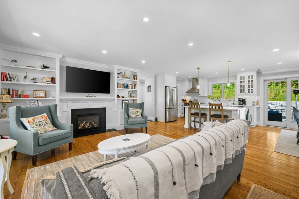 Open concept living with living area, kitchen and dining (to the right).