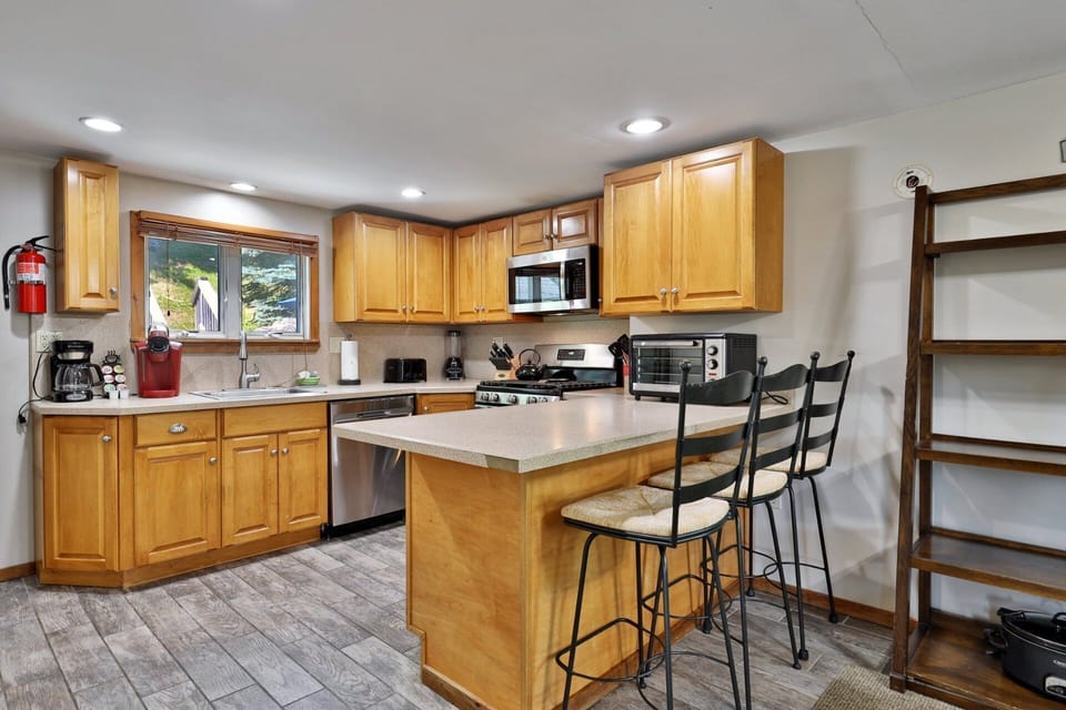 Chat over coffee at the breakfast bar while meals take shape just across the counter.